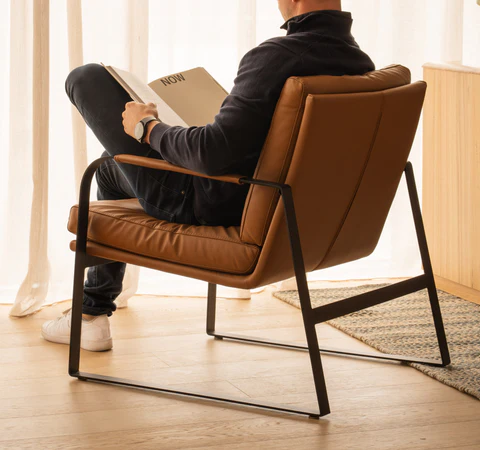 man in leather armchair